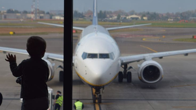 kid sad airport